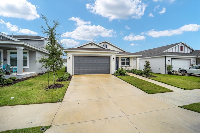 view of front of home with a front lawn and a garage