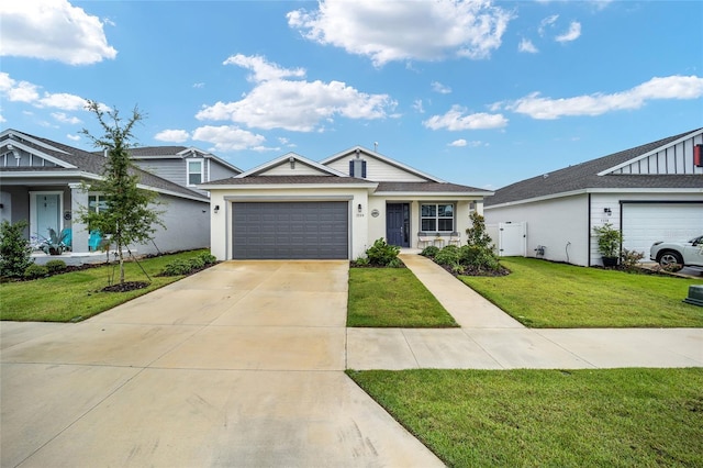 ranch-style home featuring a garage and a front lawn