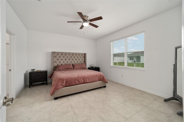 tiled bedroom with ceiling fan