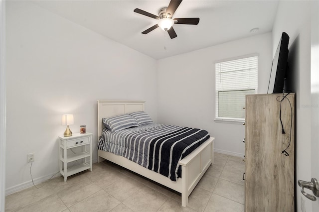 tiled bedroom with ceiling fan