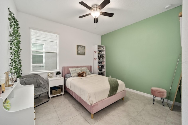 tiled bedroom with ceiling fan