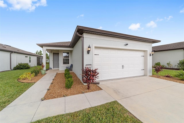 view of front of property featuring a front lawn and a garage