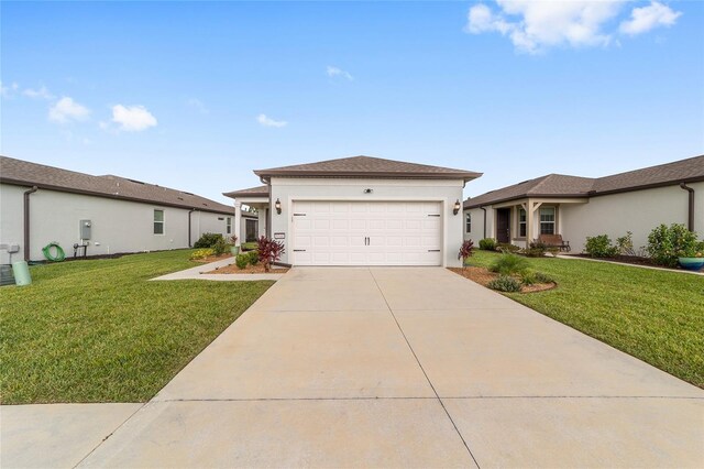 view of front facade featuring a garage and a front lawn