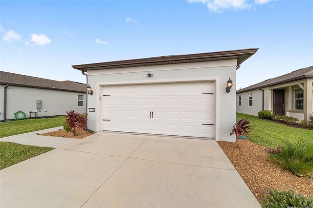 garage featuring a lawn