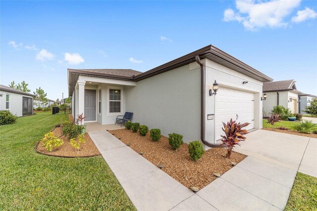 ranch-style home with a front yard and a garage