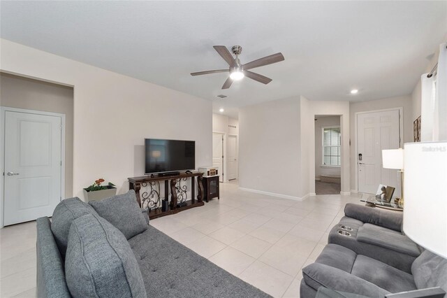 living room with light tile patterned floors and ceiling fan