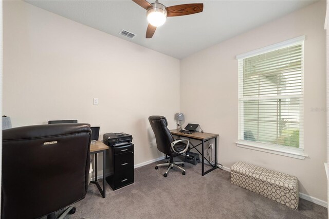 carpeted office with vaulted ceiling and ceiling fan