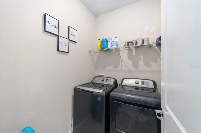 washroom featuring washer and dryer