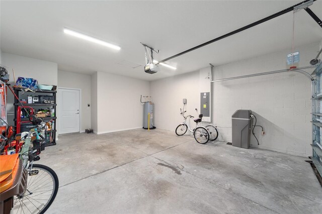 garage with a garage door opener, electric water heater, and electric panel