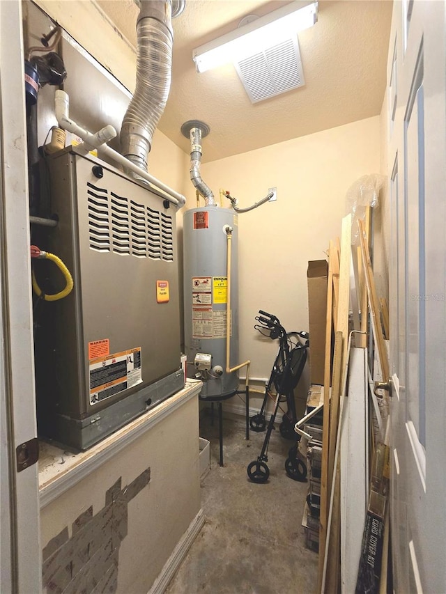 utility room featuring gas water heater