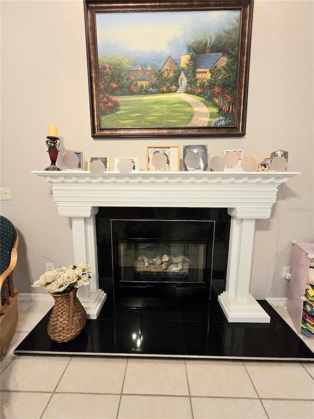 interior details with a tile fireplace