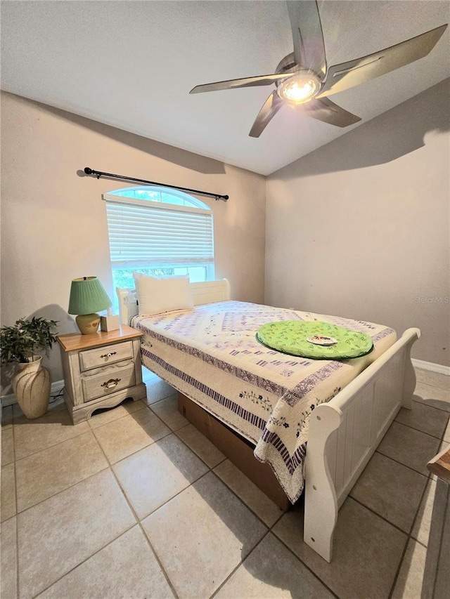 tiled bedroom with ceiling fan