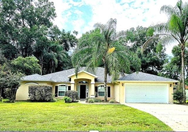 ranch-style home with a front yard and a garage