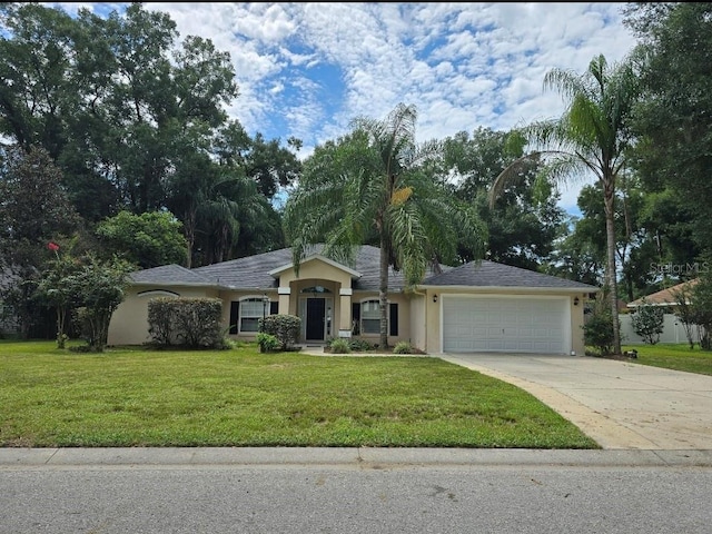 ranch-style house featuring a garage and a front lawn