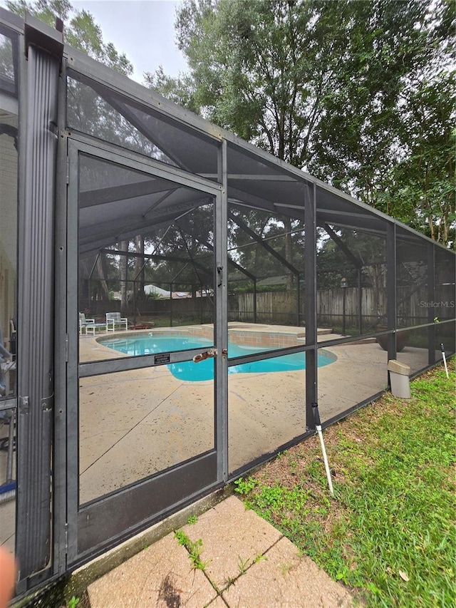 view of pool featuring a lanai, a fenced in pool, and a patio