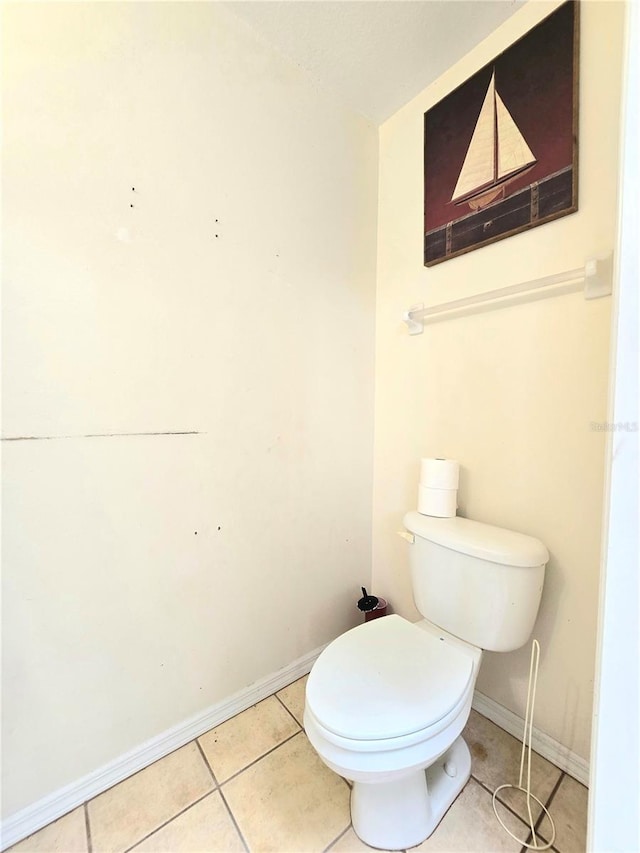 bathroom with tile patterned flooring and toilet