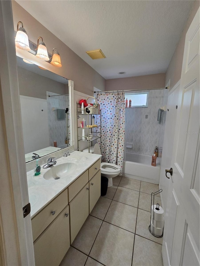 full bathroom featuring vanity, a textured ceiling, shower / bathtub combination with curtain, and tile patterned flooring