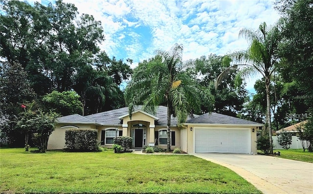 ranch-style home with a garage and a front yard