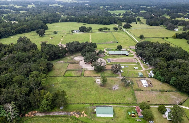 birds eye view of property with a rural view