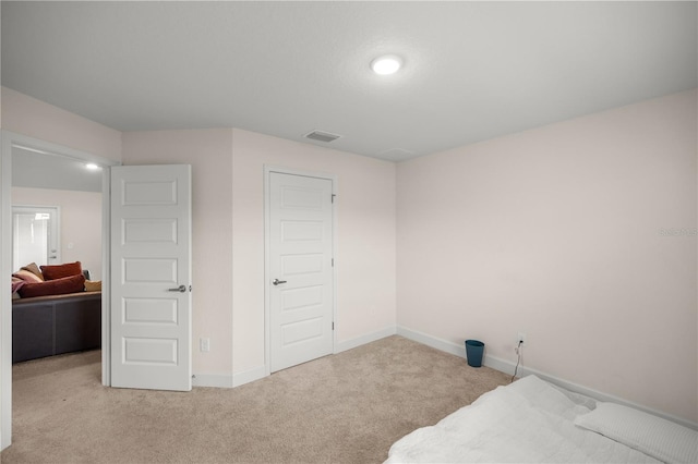 bedroom with light carpet