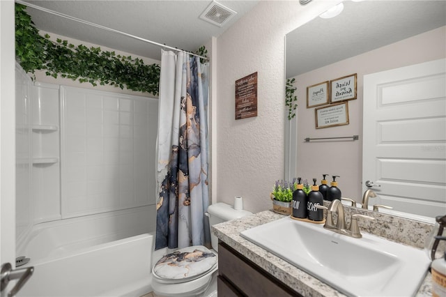 full bathroom featuring shower / bath combination with curtain, a textured ceiling, vanity, and toilet