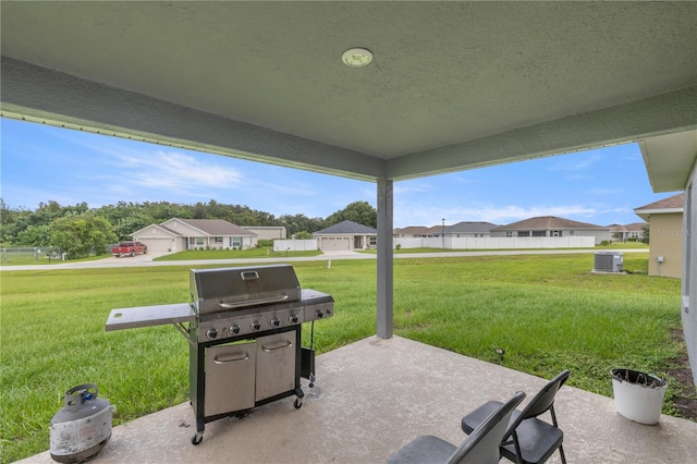 view of patio / terrace with cooling unit and a grill