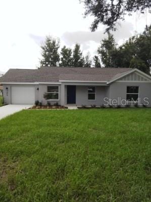 ranch-style house with a front lawn and a garage