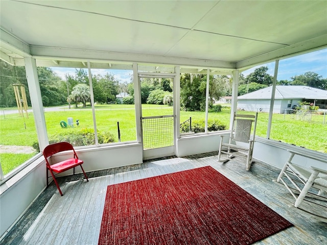 unfurnished sunroom featuring a healthy amount of sunlight