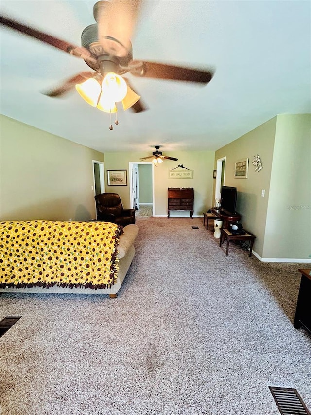 living room featuring ceiling fan and carpet flooring