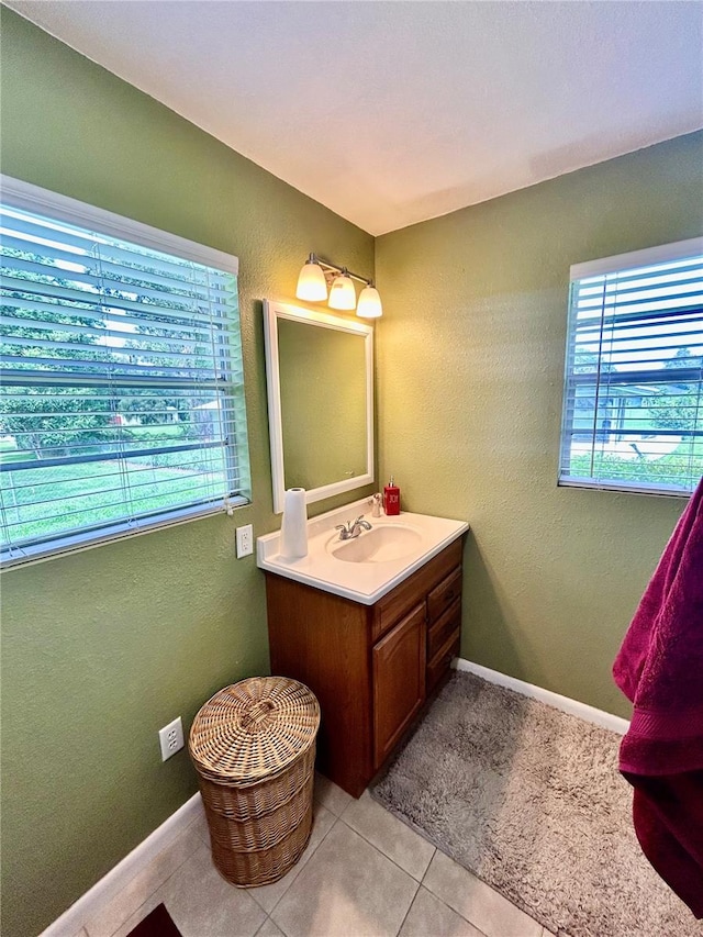 bathroom with tile patterned floors and vanity