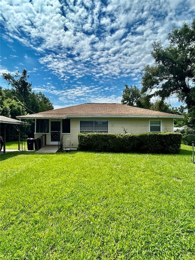 view of front of house featuring a front lawn and a patio