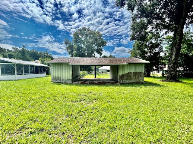 exterior space with an outbuilding and a carport