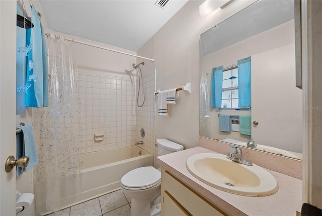 full bathroom with tile patterned floors, shower / bath combo, vanity, and toilet