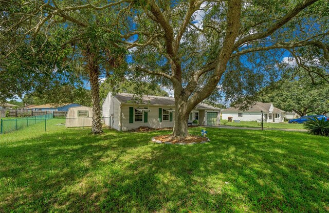 rear view of house with a yard