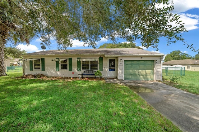 single story home featuring a garage and a front lawn