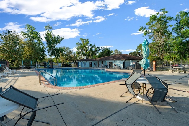 view of swimming pool with a patio