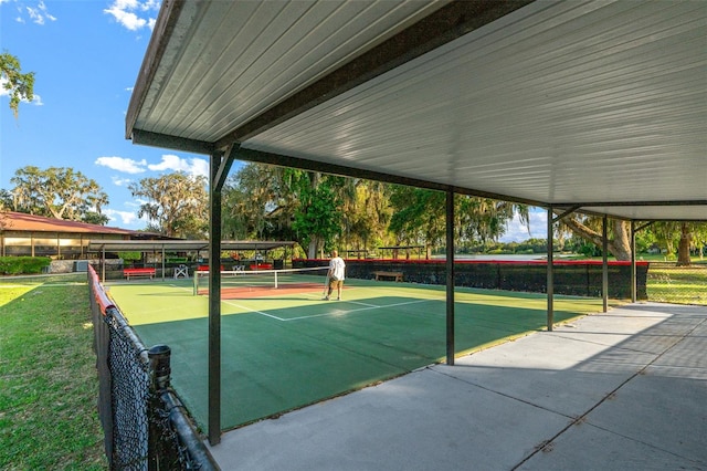 view of property's community with tennis court