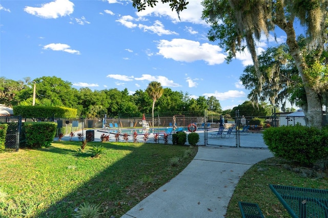 view of community with a yard