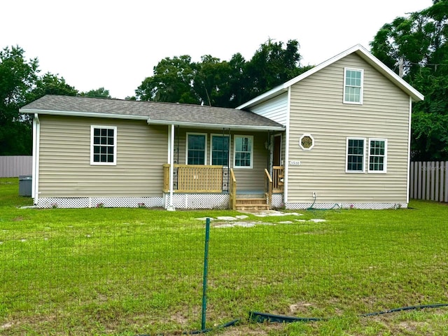 view of front of house with a front lawn and covered porch