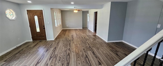 foyer entrance with ceiling fan and dark hardwood / wood-style floors