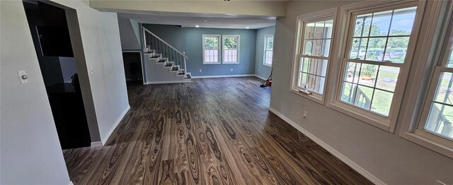 hallway featuring dark hardwood / wood-style flooring