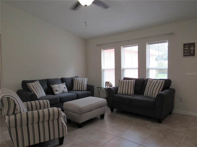 tiled living room featuring ceiling fan