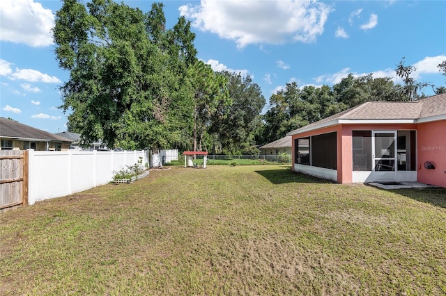 view of yard with a sunroom