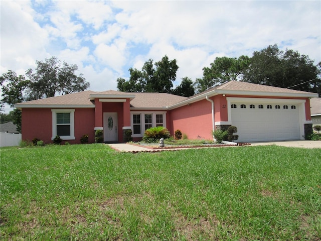 single story home featuring a front yard and a garage