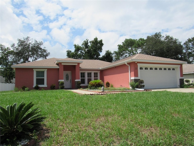 single story home with a front lawn and a garage