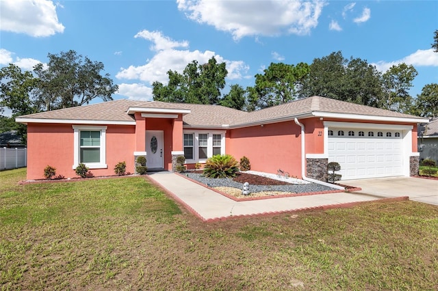 single story home with a front lawn and a garage