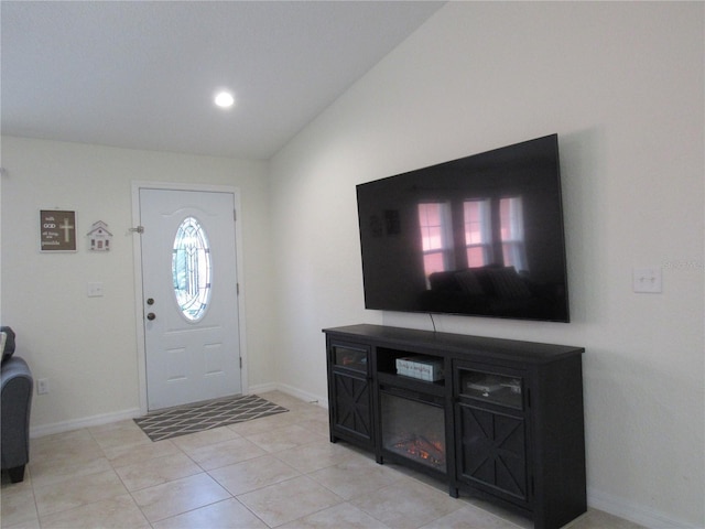 tiled entryway with lofted ceiling