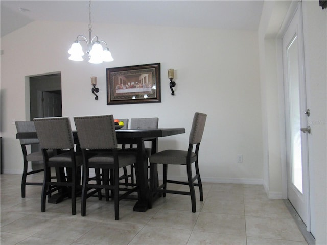 dining area featuring light tile patterned floors, vaulted ceiling, and a notable chandelier