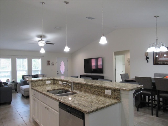 kitchen with white cabinetry, sink, dishwasher, lofted ceiling, and a center island with sink