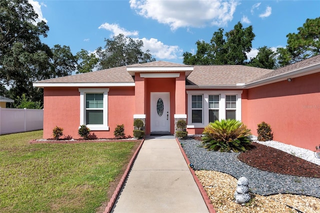 single story home with a front yard